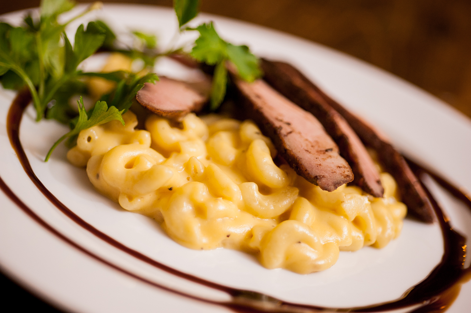 sliced beef with gourmet mac and cheese